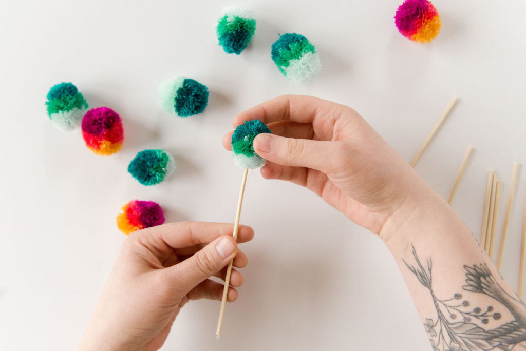 how to make poms, how to make easter egg poms, easter egg poms, easter egg brunch stir sticks, brunch decor, easy easter brunch decor, easter brunch ideas