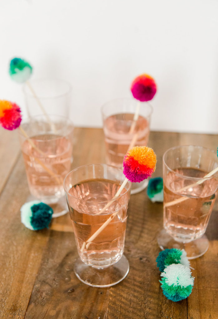 how to make poms, how to make easter egg poms, easter egg poms, easter egg brunch stir sticks, brunch decor, easy easter brunch decor, easter brunch ideas