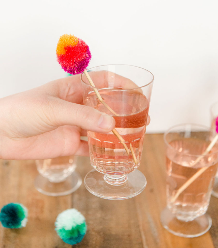 how to make poms, how to make easter egg poms, easter egg poms, easter egg brunch stir sticks, brunch decor, easy easter brunch decor, easter brunch ideas